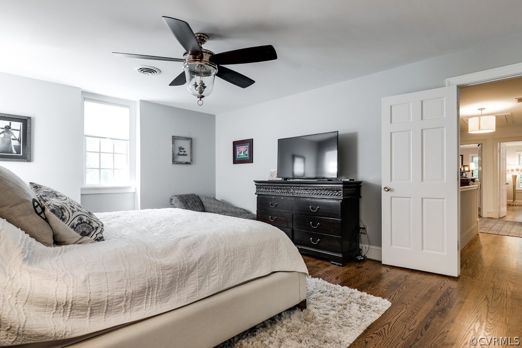 10300 Apache Road Richmond, VA 23235 - Photo 38 of 48 a bedroom with a bed and wooden floor