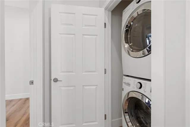 a view of a hallway with washer and dryer