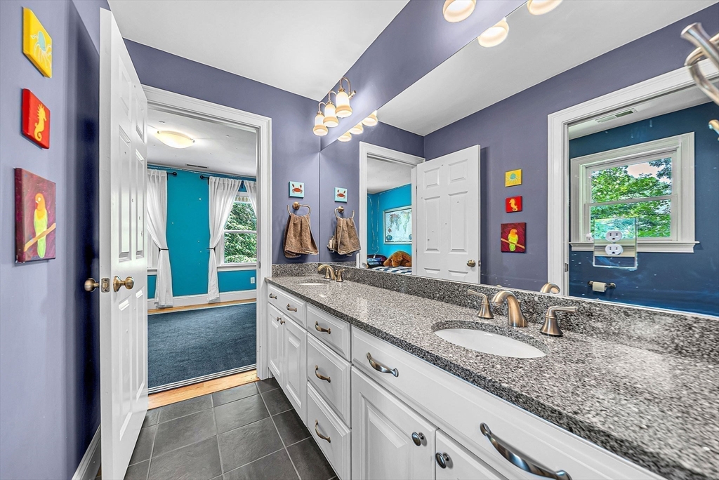 24 Summit Road Wellesley, MA 02482 - Photo 16 of 27 a bathroom with a granite countertop sink and a mirror