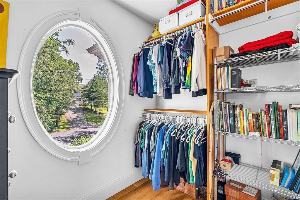 24 Summit Road Wellesley, MA 02482 - Photo 17 of 27 a view of walk in closet with clothes and shoes