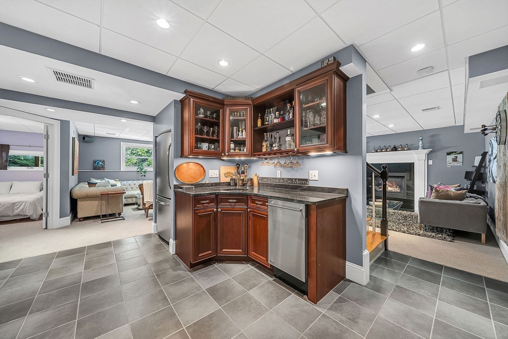 24 Summit Road Wellesley, MA 02482 - Photo 22 of 27 a kitchen with stainless steel appliances granite countertop a sink and a stove
