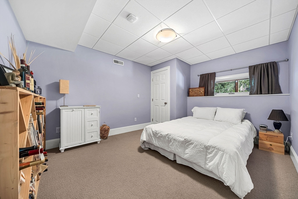 24 Summit Road Wellesley, MA 02482 - Photo 23 of 27 a bedroom with a bed and a refrigerator