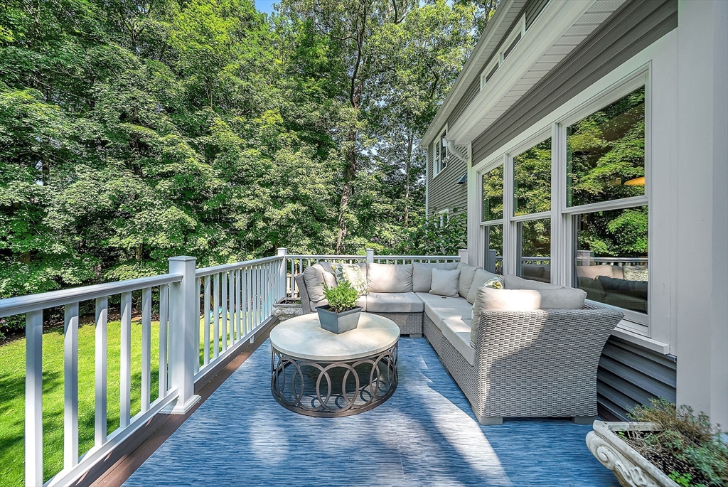 24 Summit Road Wellesley, MA 02482 - Photo 25 of 27 a view of a patio with a table and chairs