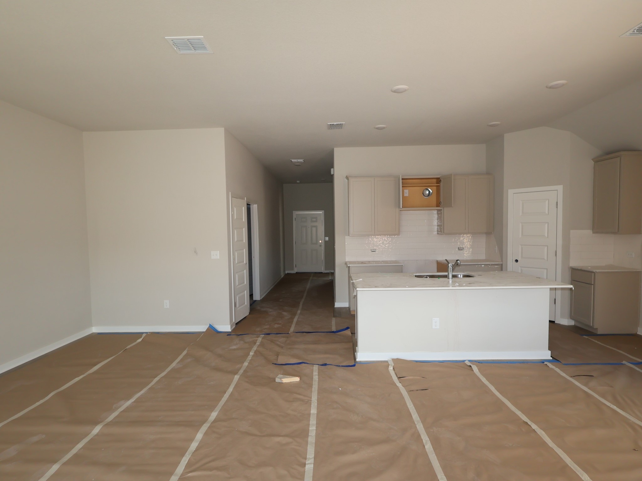 4517 Lava Island Drive Austin, TX 78747 - Photo 2 of 22 a view of a kitchen with a sink and a living room area