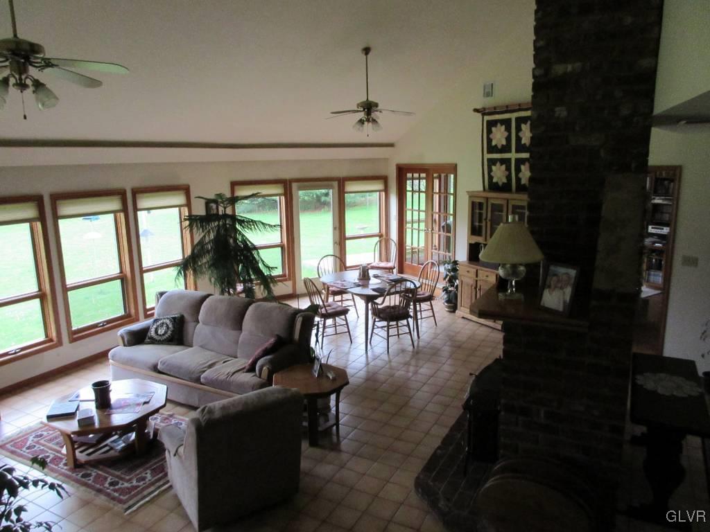 541 Roberts Road Nazareth, PA 18064 - Photo 2 of 6 a living room with fireplace furniture and a large window