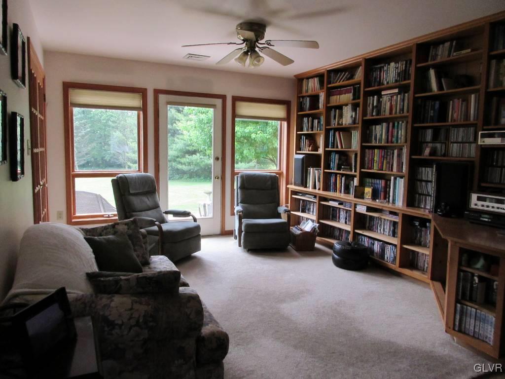 541 Roberts Road Nazareth, PA 18064 - Photo 4 of 6 a living room with furniture cabinets and a flat screen tv