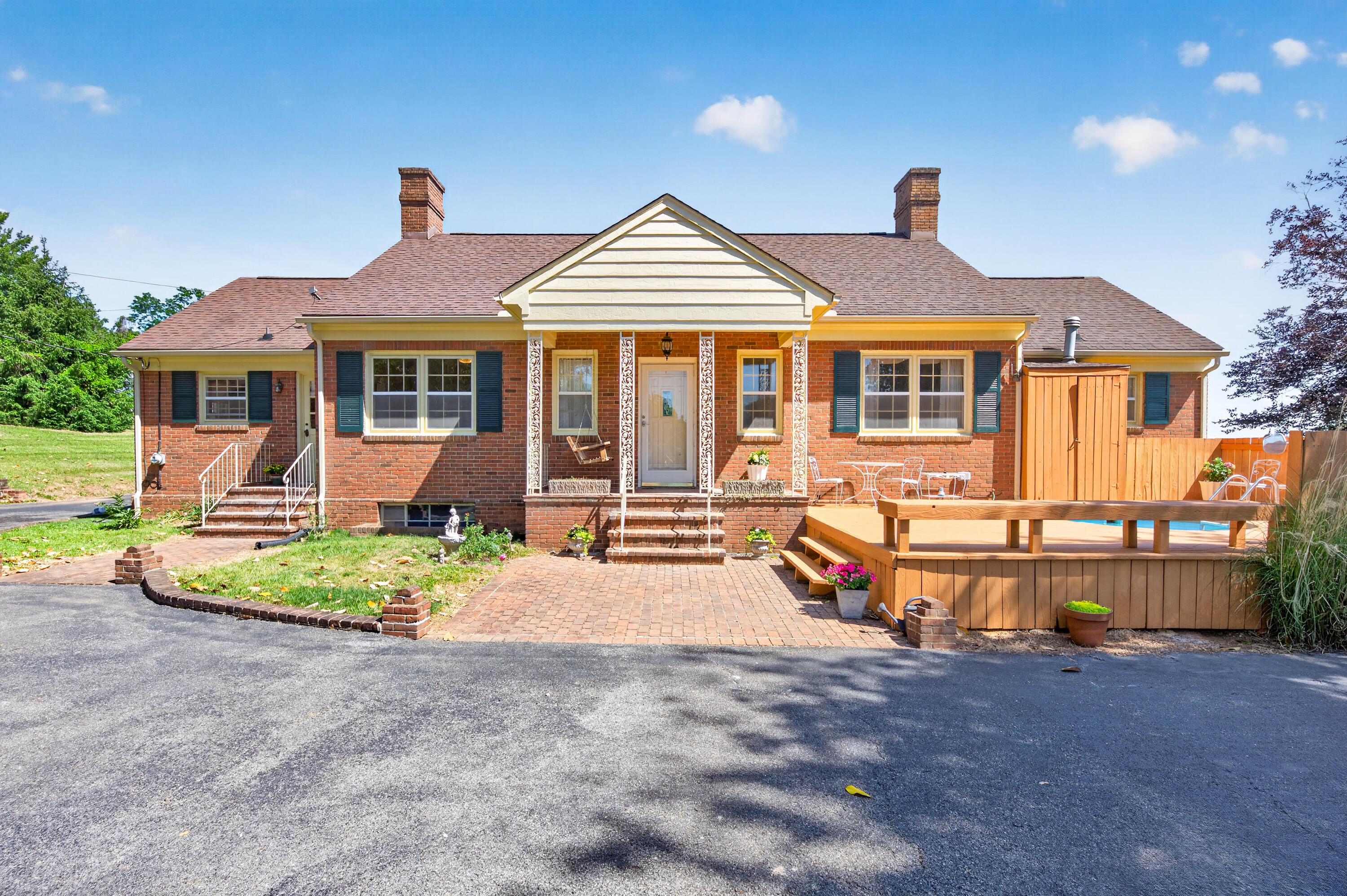 4322 Rosecrest Road Roanoke, VA 24018 - Photo 4 of 36 a front view of a house with a yard and potted plants