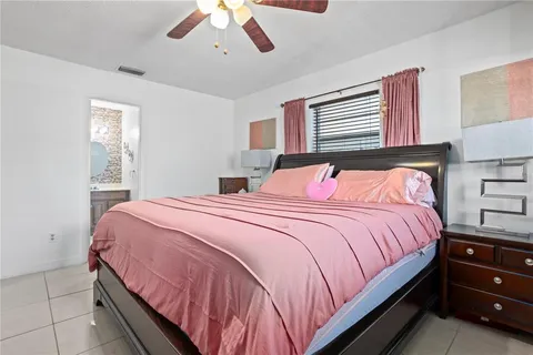 a bathroom with a toilet a sink and curtain