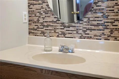 a view of walk in closet with clothes