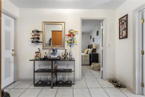 a bedroom with a bed and flat screen tv
