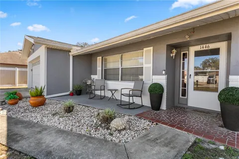 a view of a house with outdoor seating space