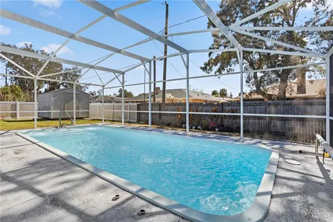 a view of a swimming pool with a patio