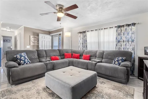 a living room with furniture and a window
