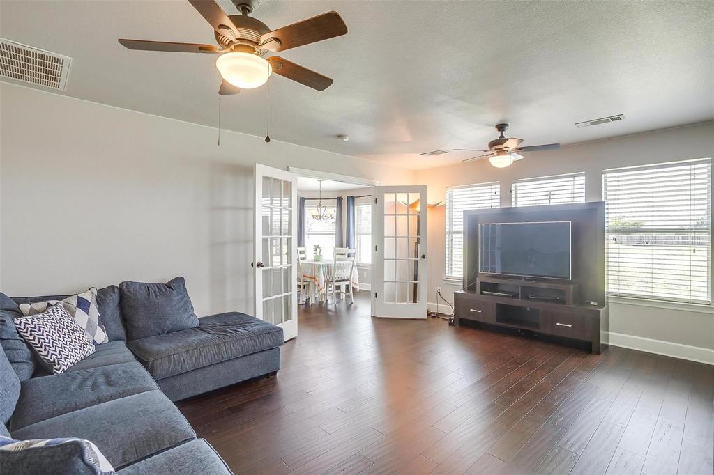 101 Springfield Lane Red Oak, TX 75165 - Photo 16 of 38 a living room with furniture and wooden floor