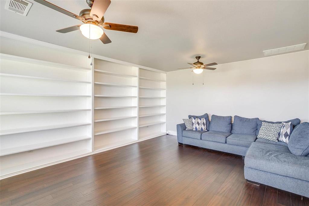 101 Springfield Lane Red Oak, TX 75165 - Photo 17 of 38 a living room with furniture and a ceiling fan