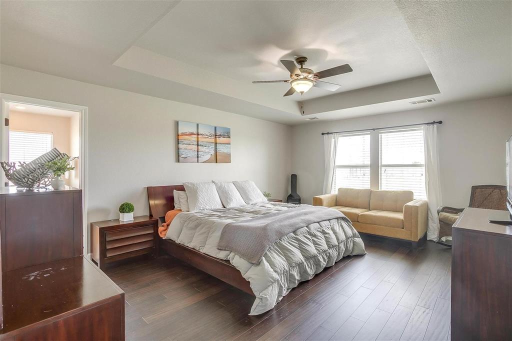 101 Springfield Lane Red Oak, TX 75165 - Photo 19 of 38 a bedroom with a bed and a large window