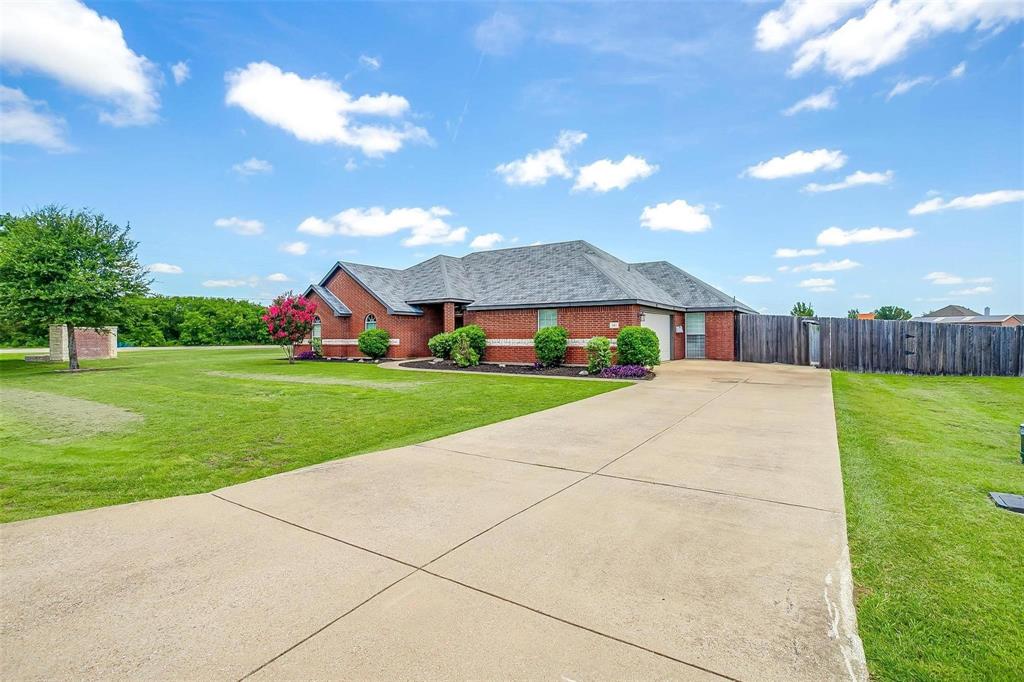 101 Springfield Lane Red Oak, TX 75165 - Photo 2 of 38 a front view of a house with garden
