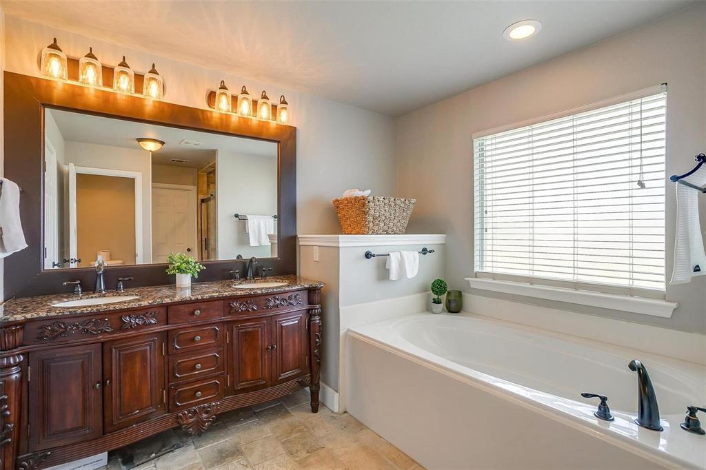 101 Springfield Lane Red Oak, TX 75165 - Photo 23 of 38 a bathroom with a tub sink and mirror