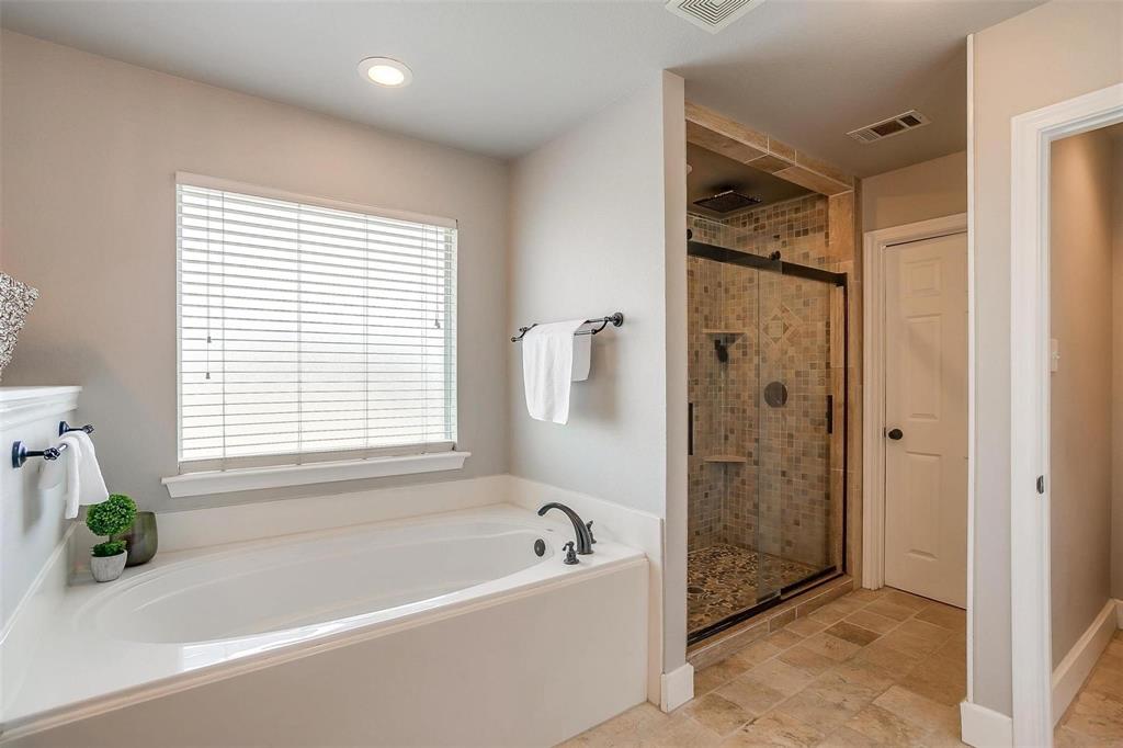 101 Springfield Lane Red Oak, TX 75165 - Photo 24 of 38 a bathroom with a bathtub and shower