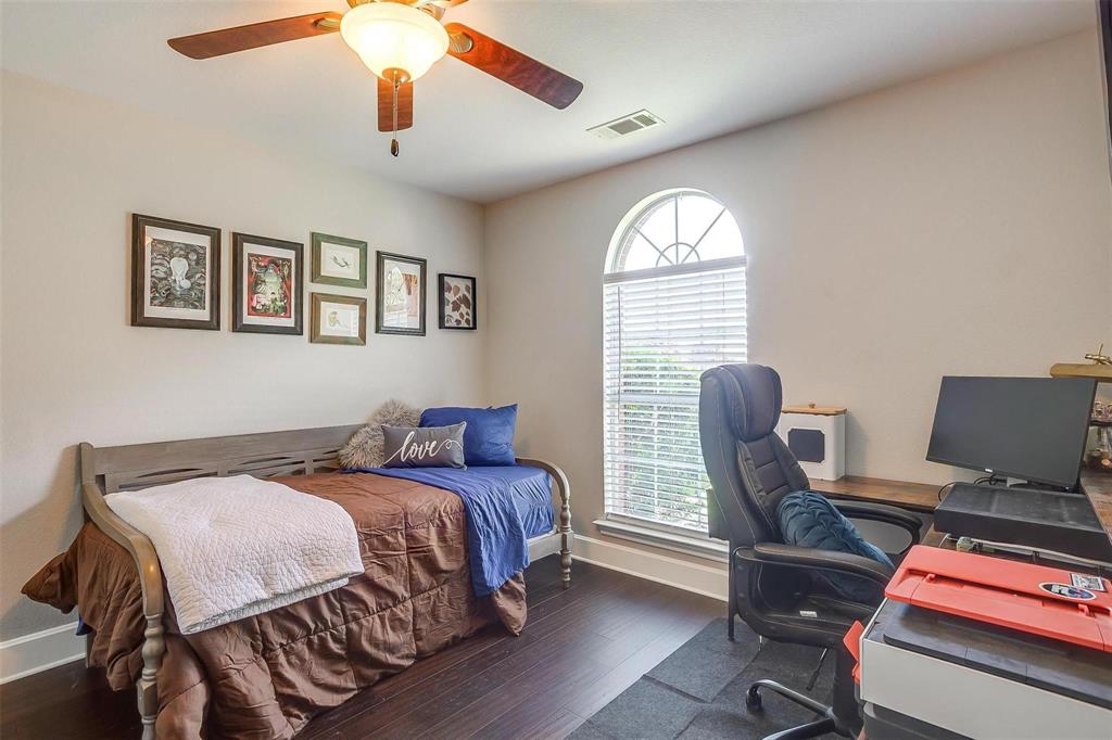 101 Springfield Lane Red Oak, TX 75165 - Photo 25 of 38 a bedroom with a bed and a window