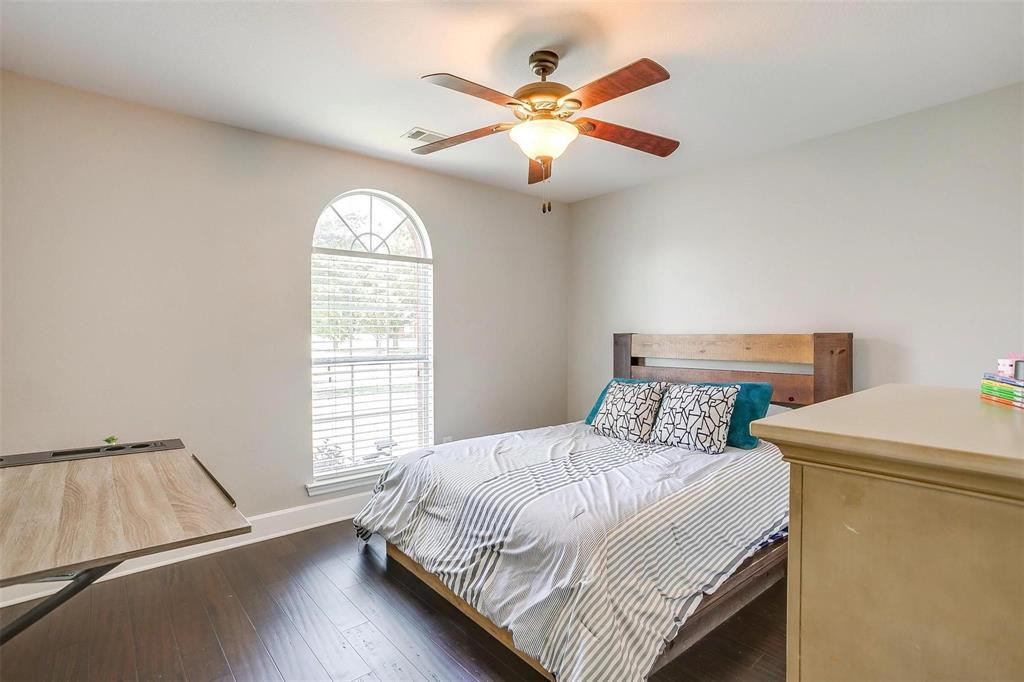 101 Springfield Lane Red Oak, TX 75165 - Photo 28 of 38 a bedroom with a bed and a window