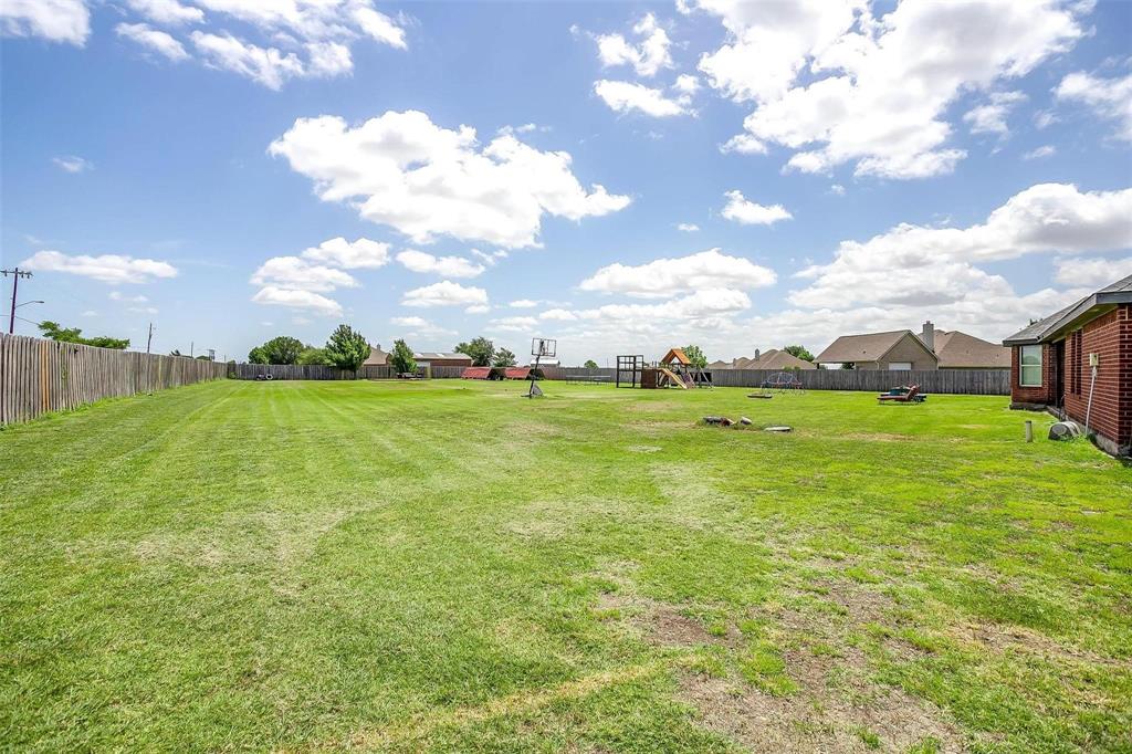 101 Springfield Lane Red Oak, TX 75165 - Photo 35 of 38 a view of a big yard with plants and large trees