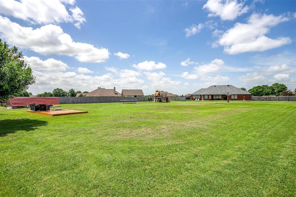 101 Springfield Lane Red Oak, TX 75165 - Photo 36 of 38 a view of yard with swimming pool and green space
