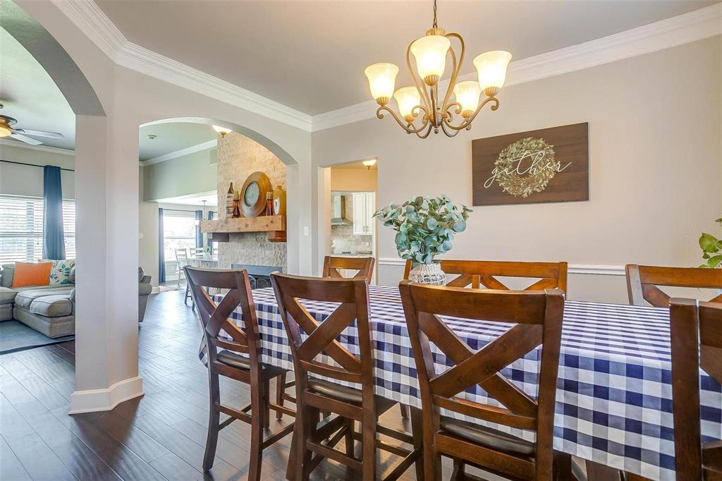 101 Springfield Lane Red Oak, TX 75165 - Photo 7 of 38 a view of a dining room with furniture and chandelier