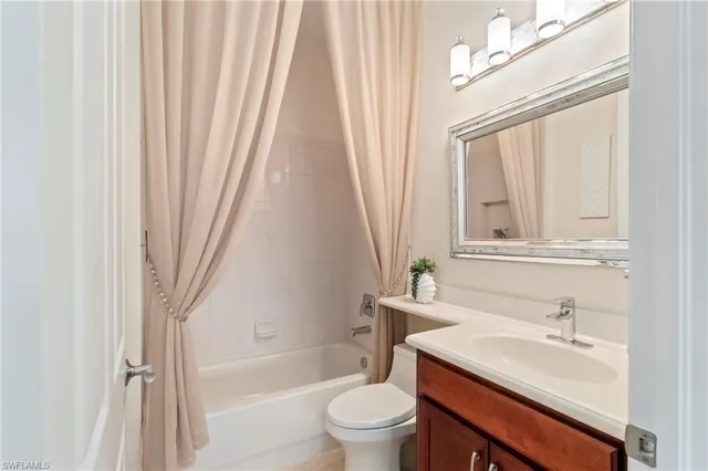 a bathroom with a sink a toilet and a tub