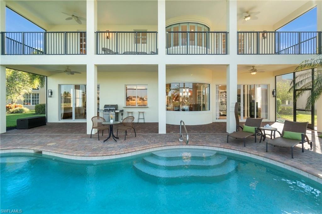 1879 Ivory Cane Point Naples, FL 34119 - Photo 41 of 49 a view of a house with swimming pool and sitting area