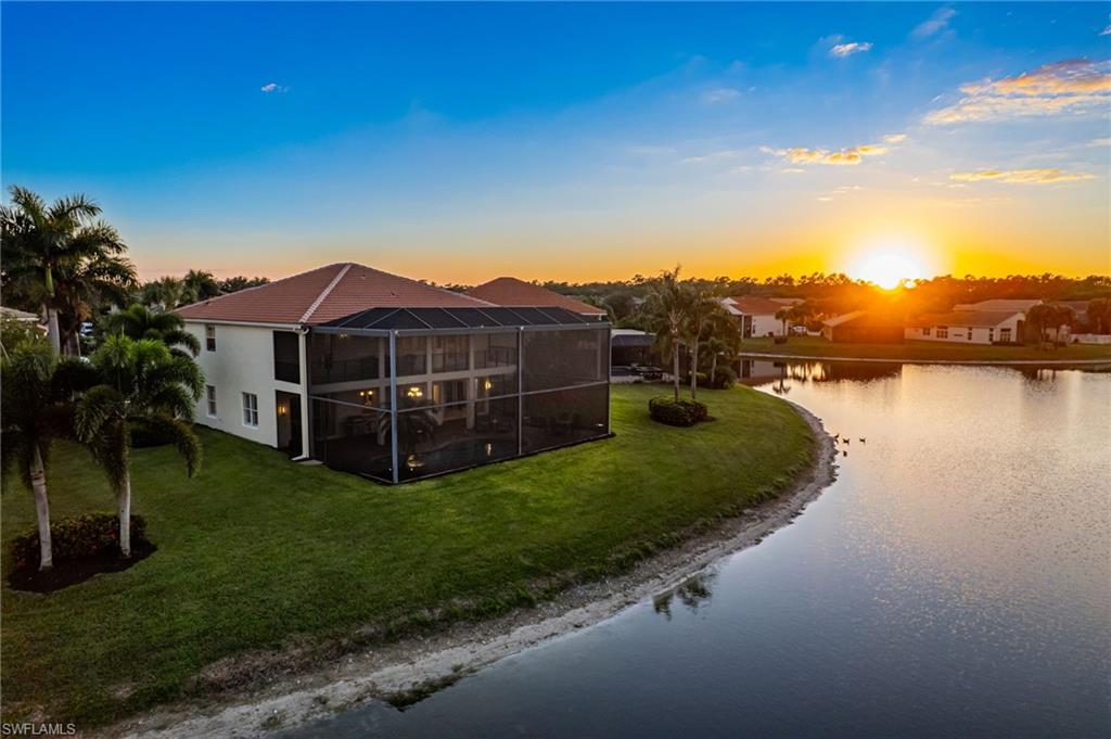 1879 Ivory Cane Point Naples, FL 34119 - Photo 48 of 49 a view of a house with a big yard and large tree