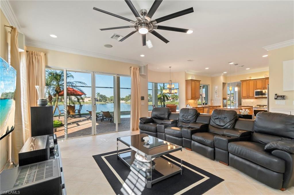 1879 Ivory Cane Point Naples, FL 34119 - Photo 8 of 49 a living room with furniture and a large window