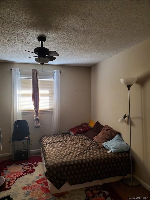 6365 Bringle Ferry Road Salisbury, NC 28146 - Photo 11 of 16 a bedroom with a bed and a window