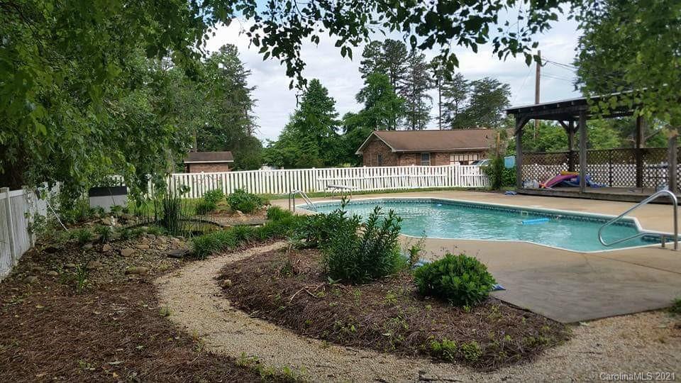 6365 Bringle Ferry Road Salisbury, NC 28146 - Photo 15 of 16 a view of a lake with a building in the background