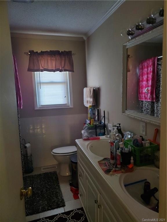 6365 Bringle Ferry Road Salisbury, NC 28146 - Photo 9 of 16 a bathroom with a sink and a mirror