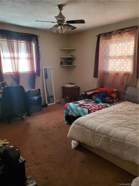 6365 Bringle Ferry Road Salisbury, NC 28146 - Photo 10 of 16 a bedroom with a bed and a window
