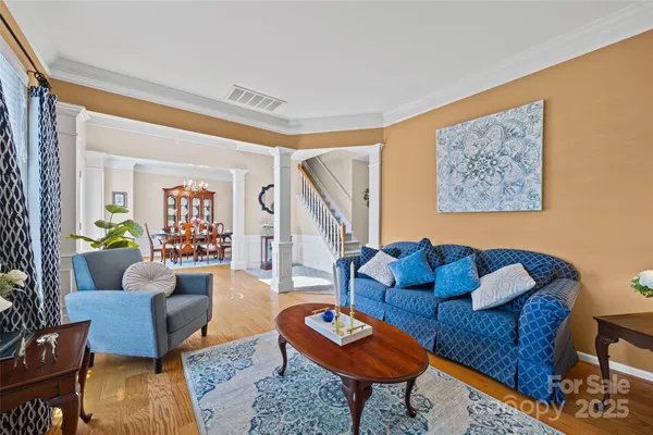 a living room with furniture and a rug