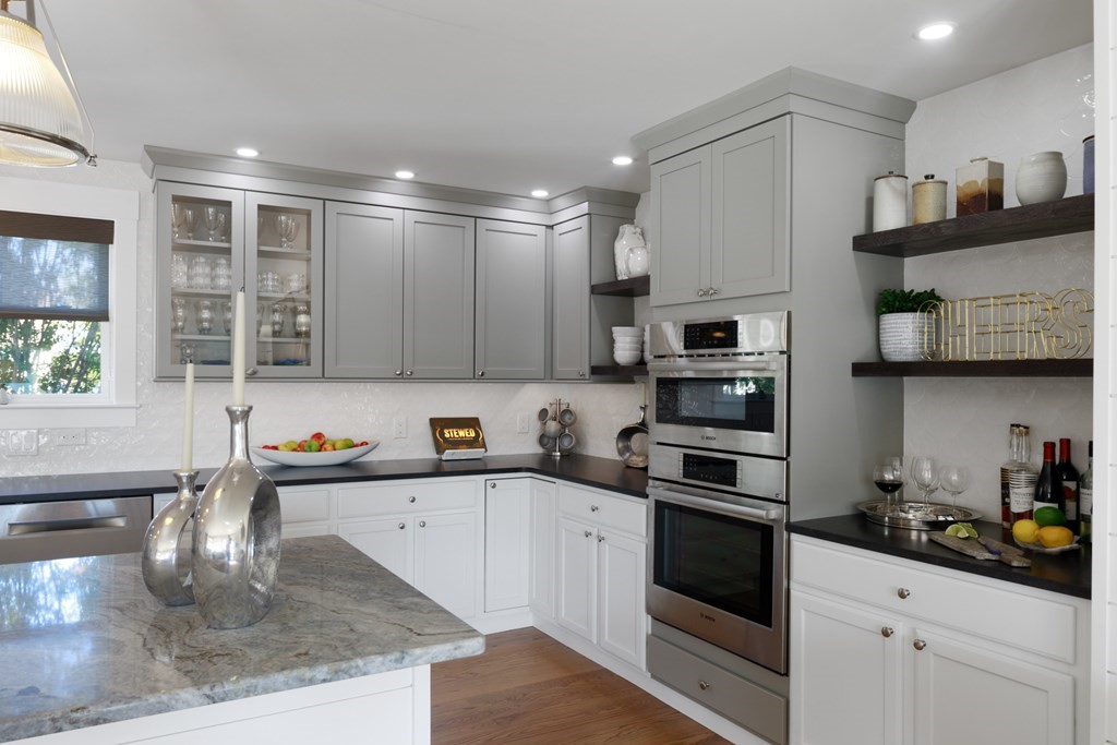 18 Clifton Avenue Hull, MA 02045 - Photo 14 of 39 a kitchen with stainless steel appliances granite countertop a sink and cabinets