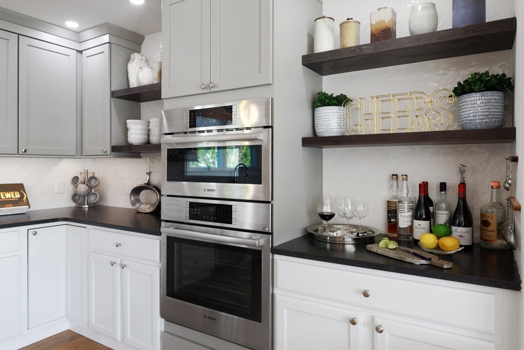 18 Clifton Avenue Hull, MA 02045 - Photo 15 of 39 a kitchen with stainless steel appliances granite countertop a sink a stove and cabinets