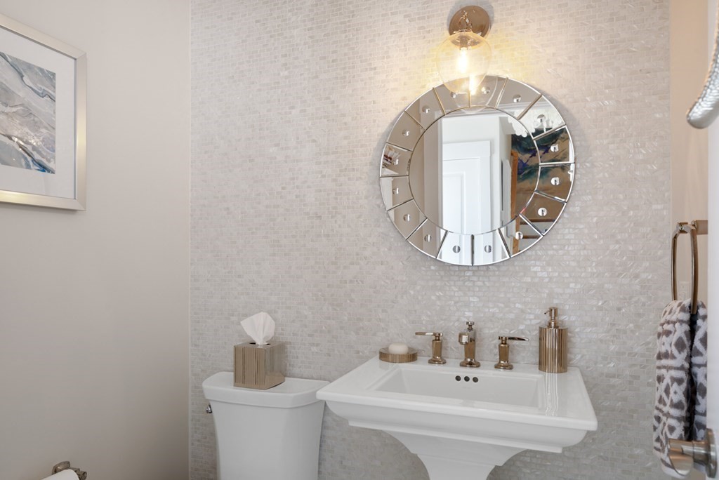 18 Clifton Avenue Hull, MA 02045 - Photo 18 of 39 a bathroom with a sink and a mirror