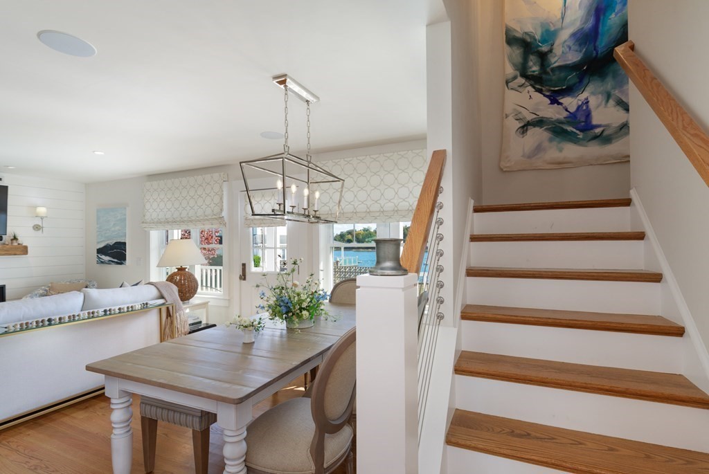 18 Clifton Avenue Hull, MA 02045 - Photo 21 of 39 a view of dining room and livingroom with furniture wooden floor a chandelier