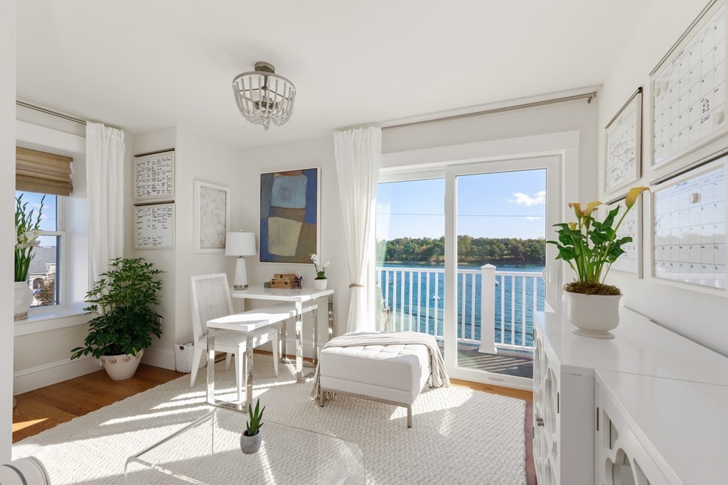 18 Clifton Avenue Hull, MA 02045 - Photo 30 of 39 a living room with furniture a fireplace and a potted plant