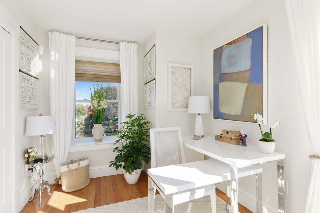 18 Clifton Avenue Hull, MA 02045 - Photo 31 of 39 a living room with furniture and a potted plant