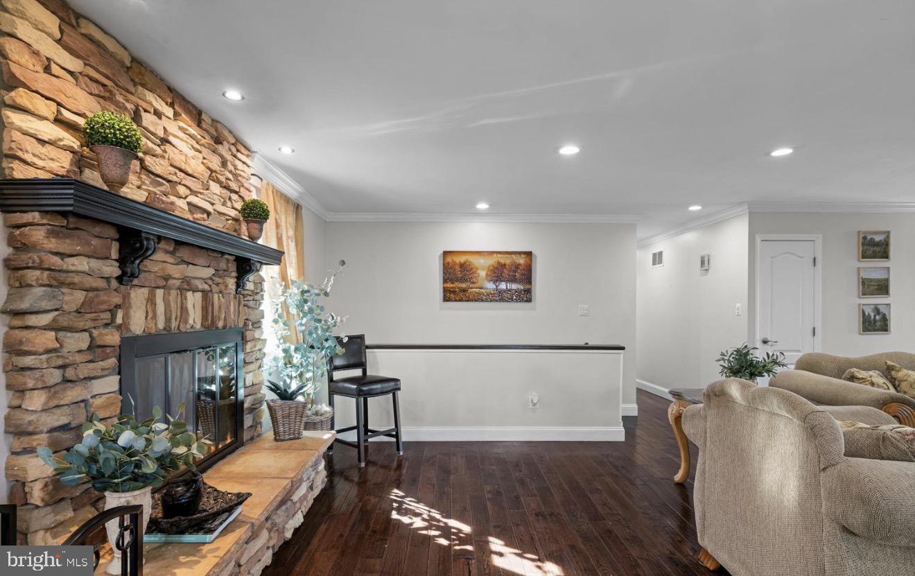 11611 Vale Road Oakton, VA 22124 - Photo 13 of 24 Cozy living space with stone fireplace.
