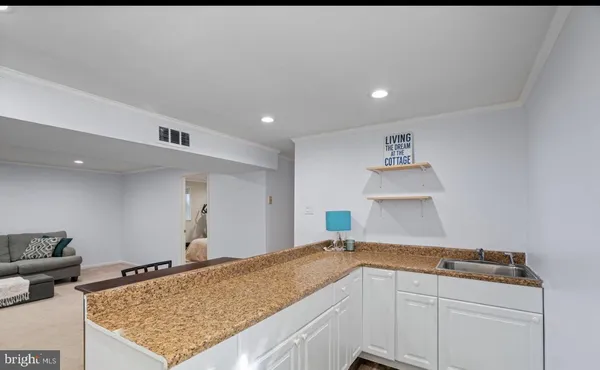 a kitchen with a sink and cabinets