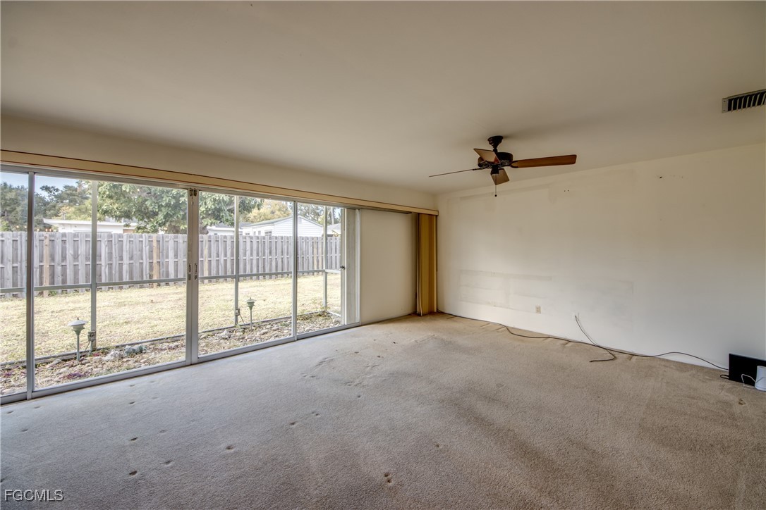 3728 Deleon Street Fort Myers, FL 33901 - Photo 24 of 50 a view of an empty room with a sliding door