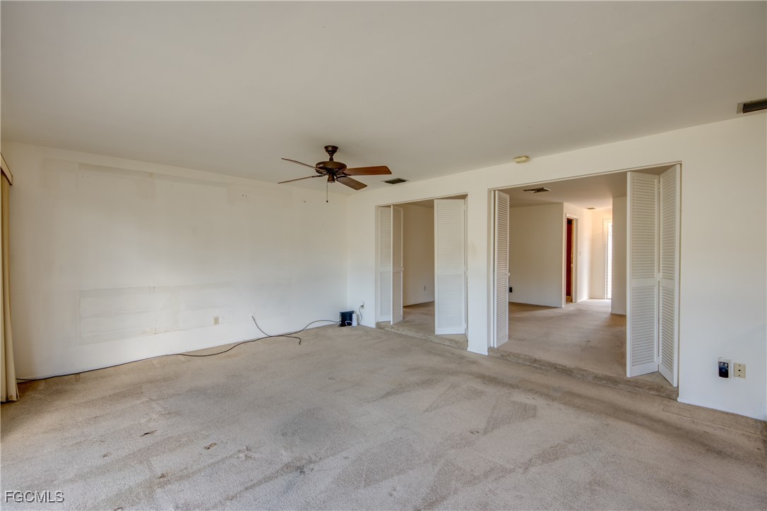 3728 Deleon Street Fort Myers, FL 33901 - Photo 26 of 50 an empty room with a empty space and a ceiling fan