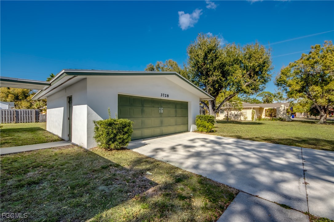 3728 Deleon Street Fort Myers, FL 33901 - Photo 3 of 50 a front view of a house with a yard