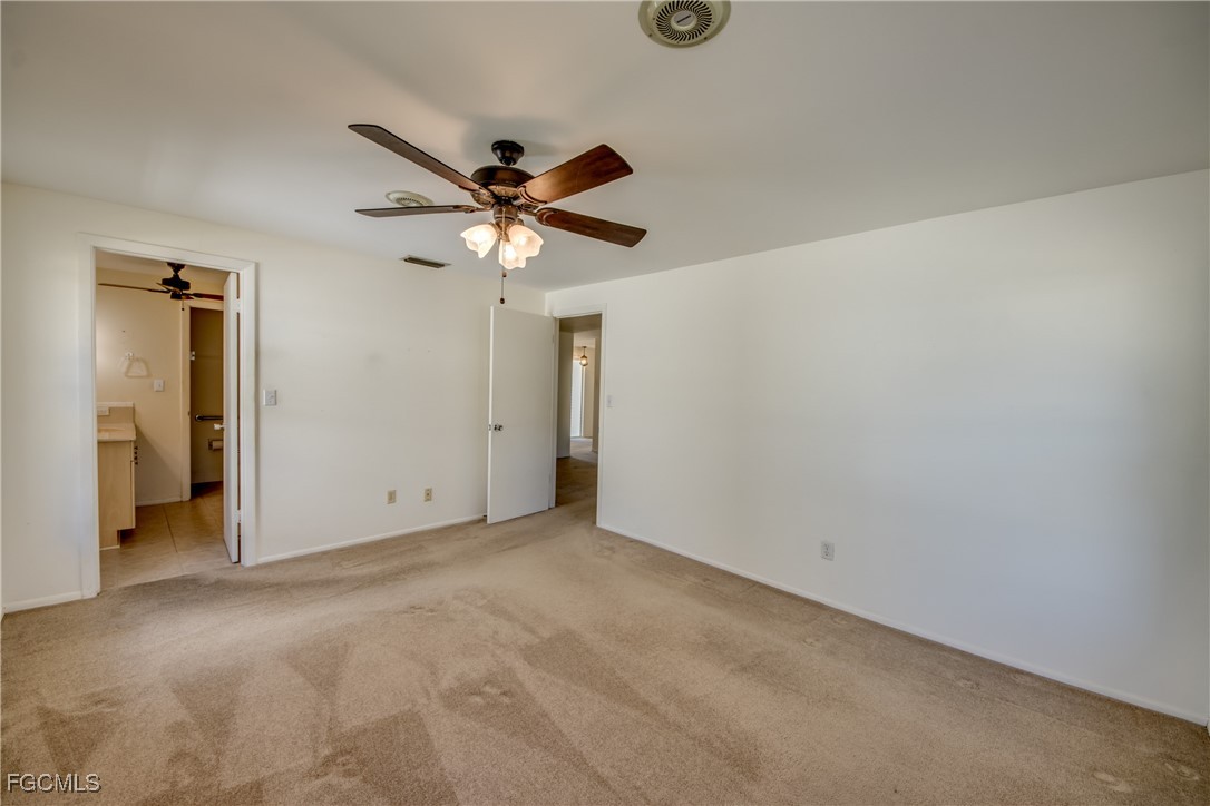 3728 Deleon Street Fort Myers, FL 33901 - Photo 32 of 50 an empty room with a ceiling fan and a window
