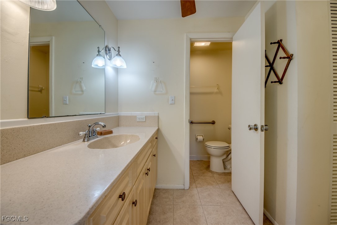 3728 Deleon Street Fort Myers, FL 33901 - Photo 34 of 50 a bathroom with a double vanity sink and a toilet